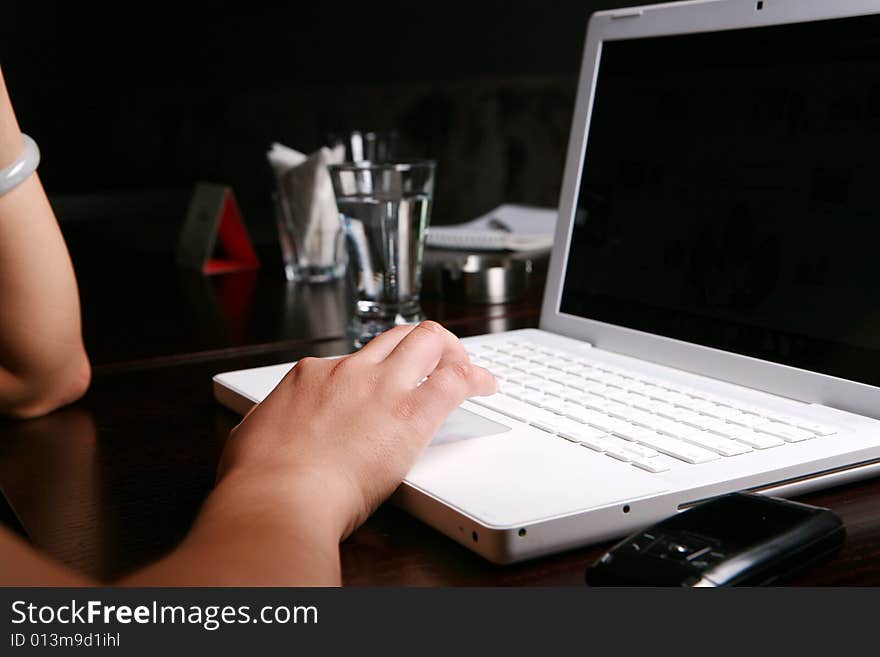 Close-up women's hand on keyboard