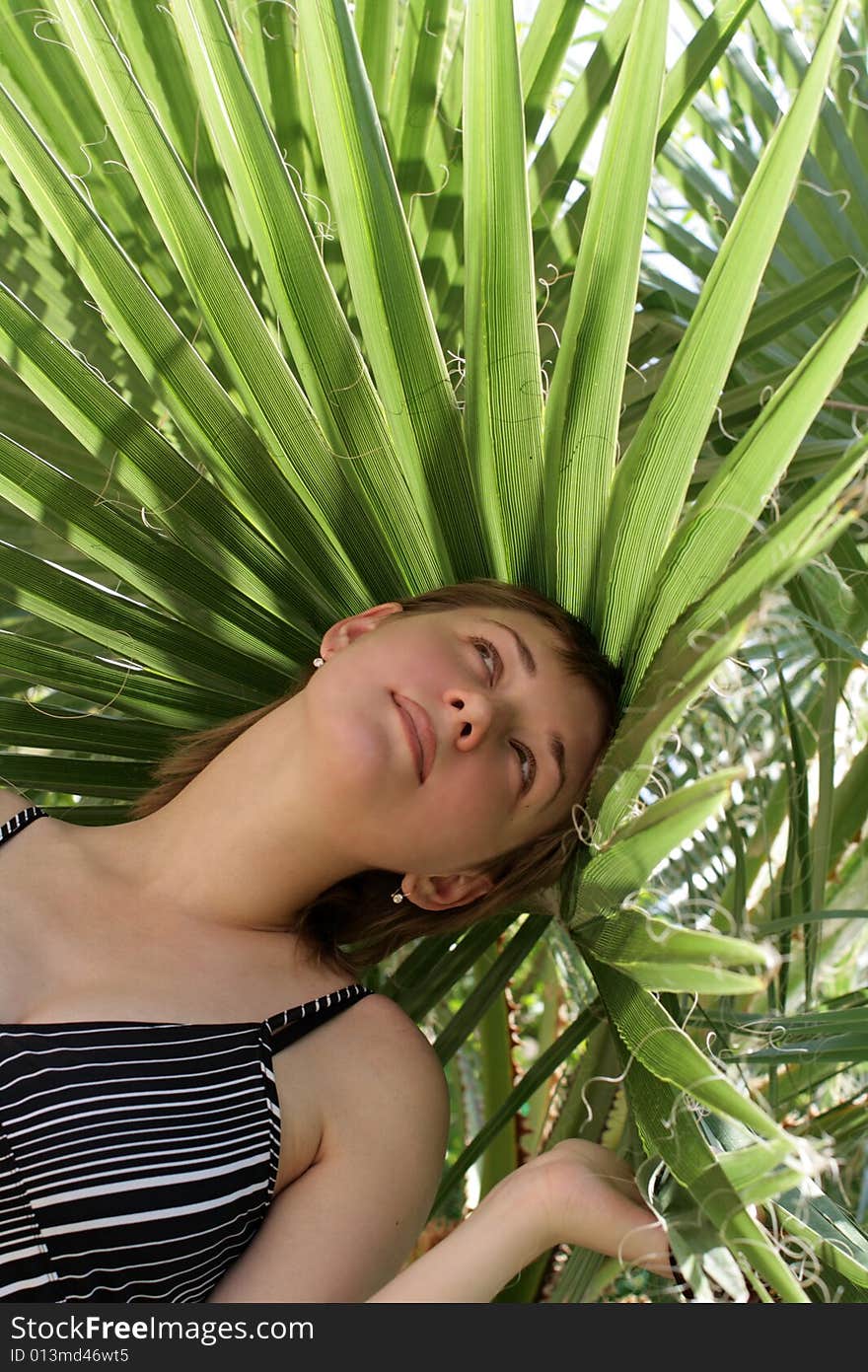 The girl poses in a botanical gardens. The girl poses in a botanical gardens