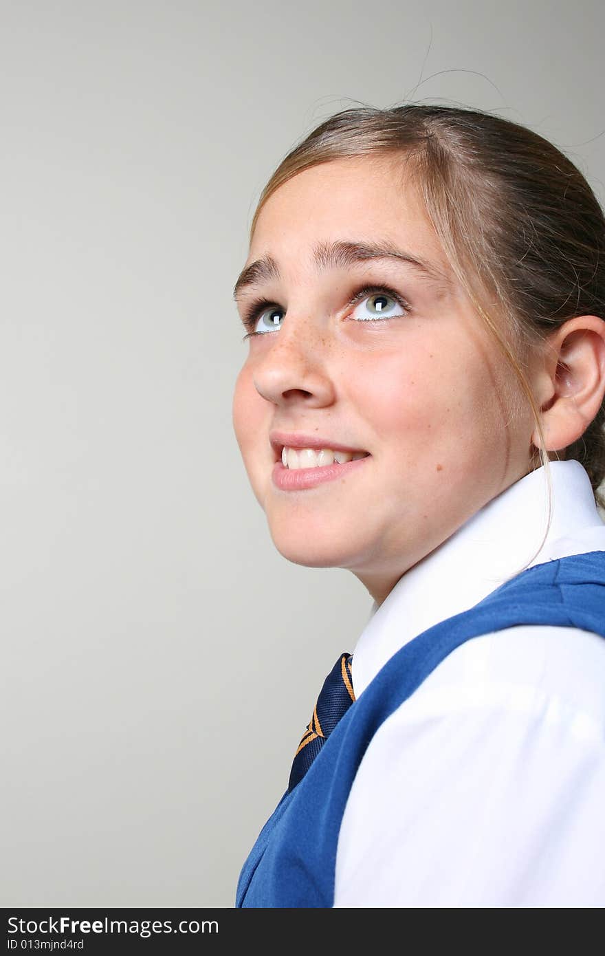 Teenage School girl in uniform with a smile