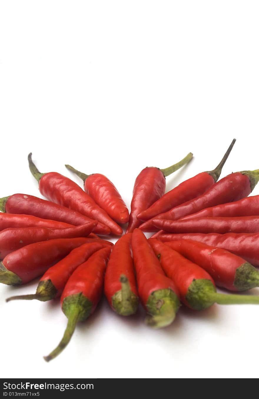 Chili  peppers against white