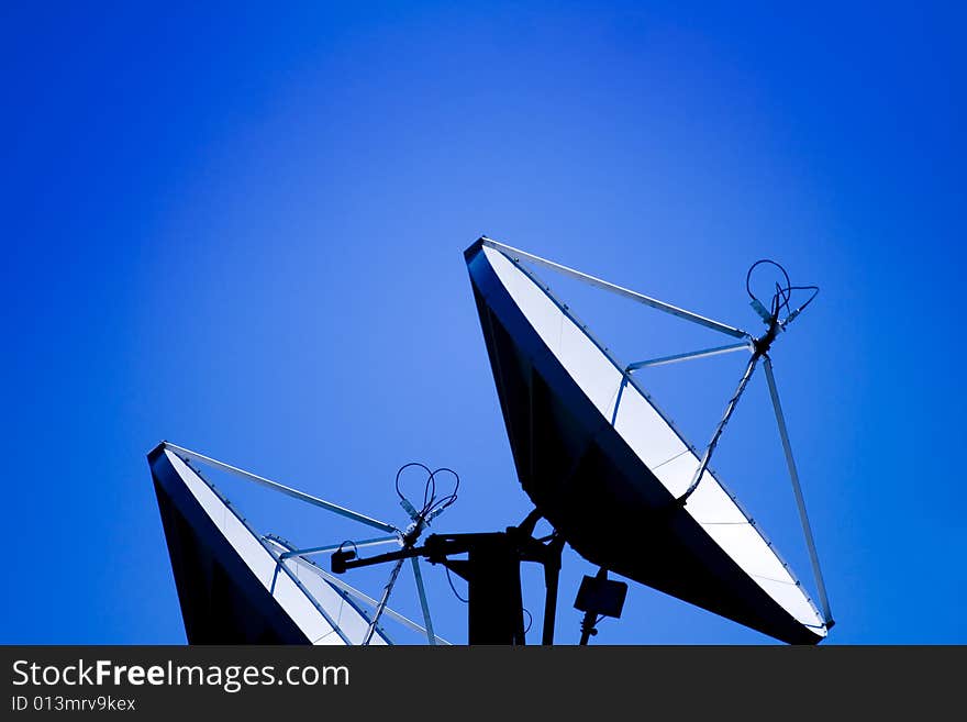 Satellite dish against blue sky