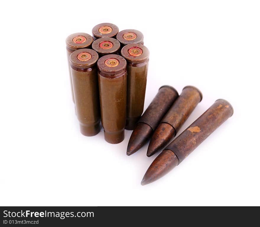 Closeup of old used 7,62 mm shells (cartriges) of AK47 and bullets of World War I isolated on white. Closeup of old used 7,62 mm shells (cartriges) of AK47 and bullets of World War I isolated on white