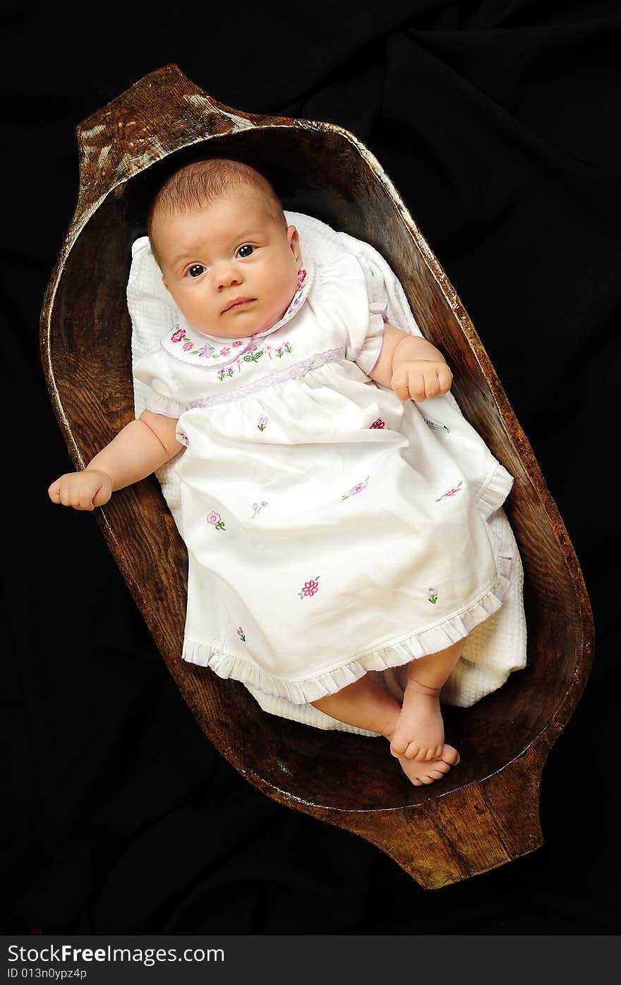 A little cute baby portrait over black. A little cute baby portrait over black