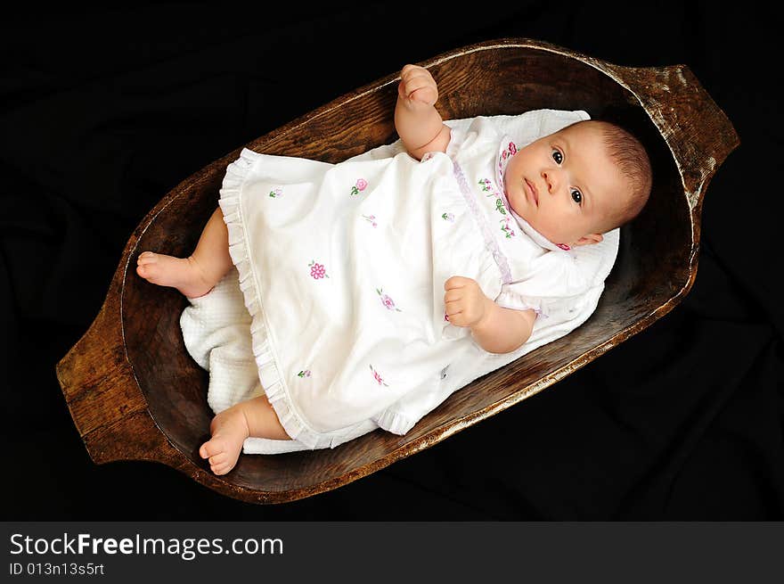 A little cute baby portrait over black. A little cute baby portrait over black