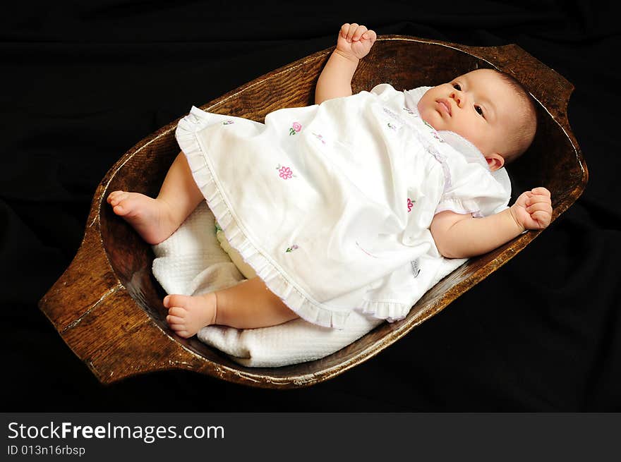 A little cute baby portrait over black. A little cute baby portrait over black