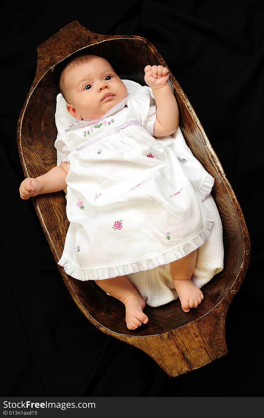 A little cute baby portrait over black. A little cute baby portrait over black