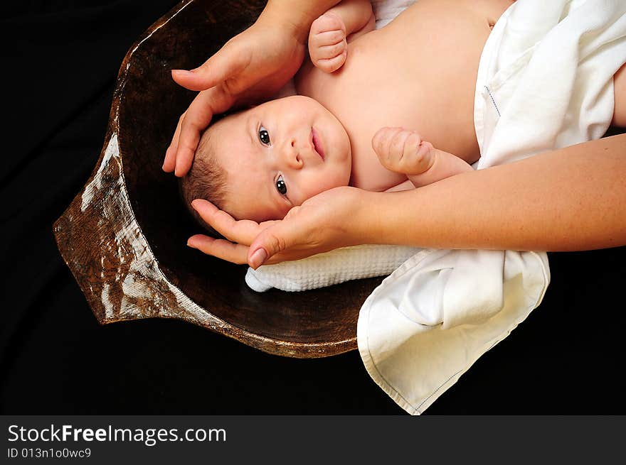 A little cute baby portrait over black. A little cute baby portrait over black