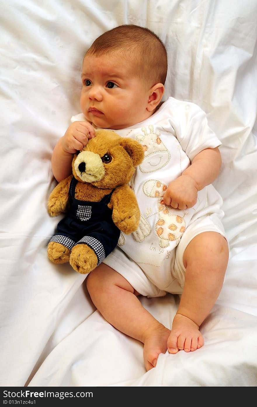 A little cute baby portrait over white. A little cute baby portrait over white