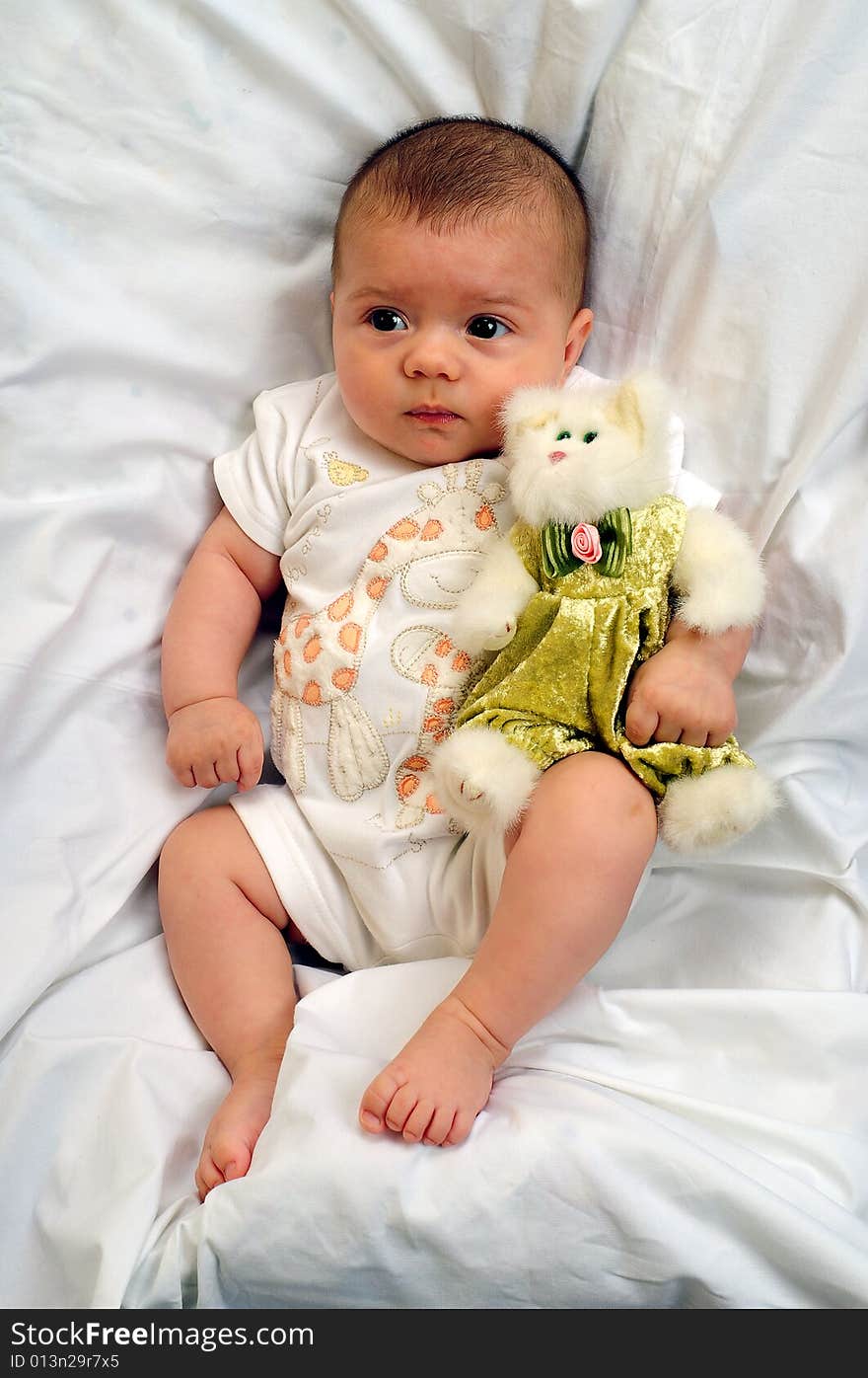 A little cute baby portrait over white. A little cute baby portrait over white