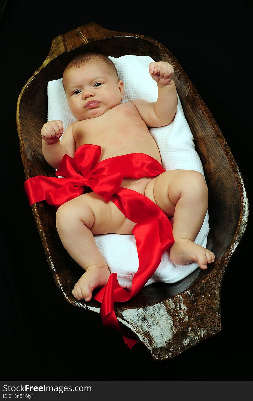 A little cute baby portrait over black. A little cute baby portrait over black