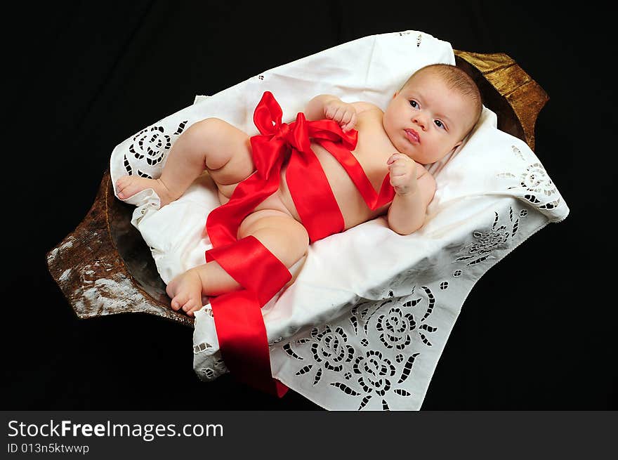 A little cute baby portrait over black. A little cute baby portrait over black