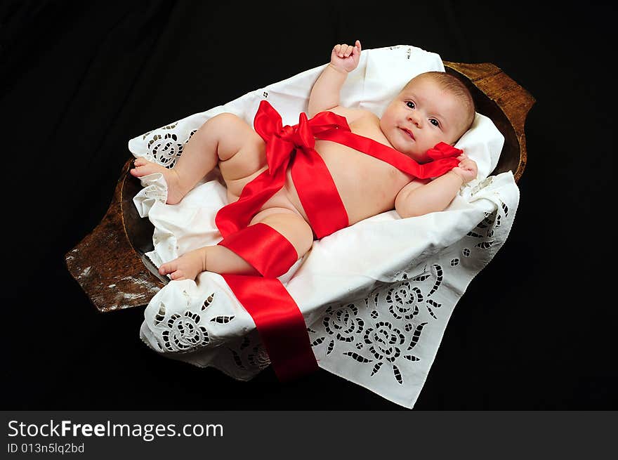 A little cute baby portrait over black. A little cute baby portrait over black