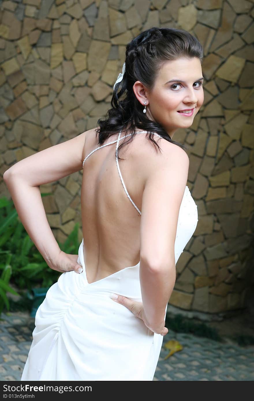 Beautiful young bride with flowers in her hair.