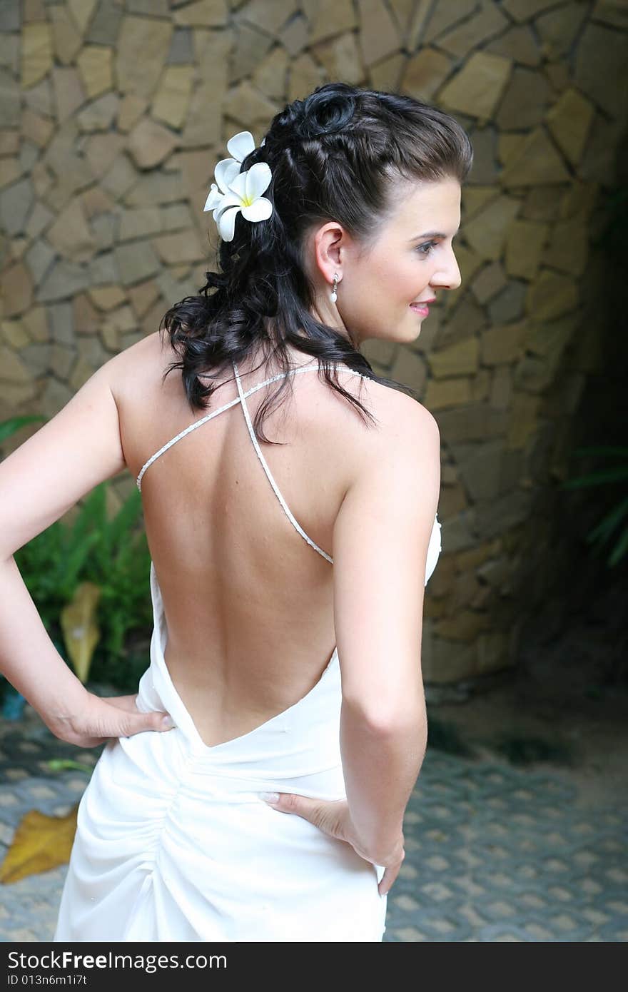 Beautiful young bride with flowers in her hair.