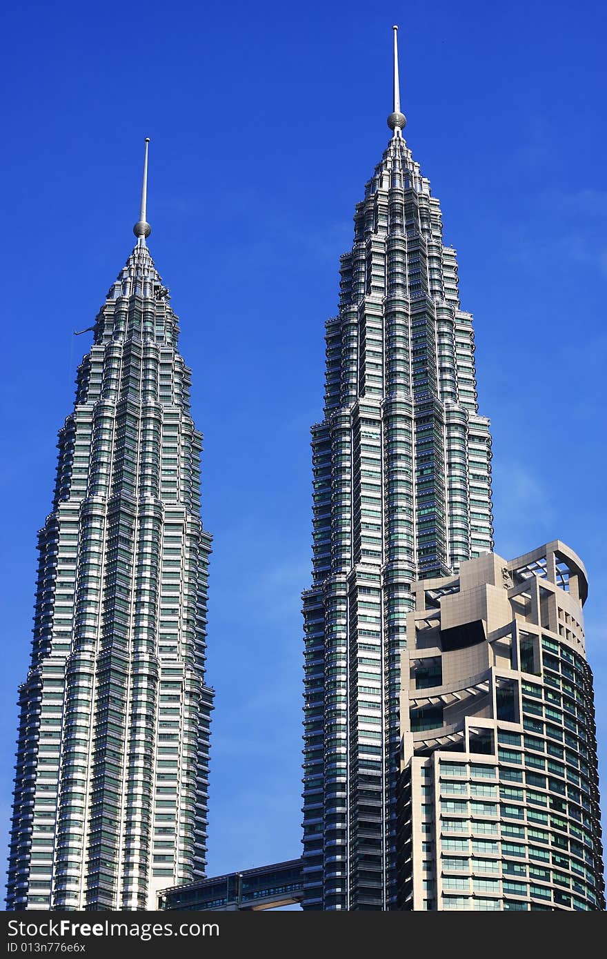 Petronas Twin Towers over blue sky in Kuala Lumpur, Malaysia.