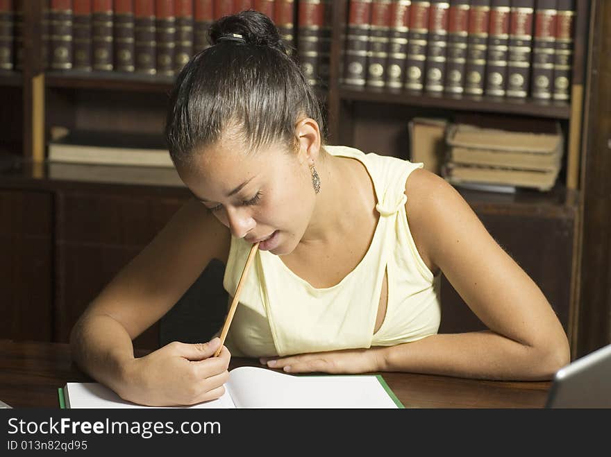 Girl in office studying. Horizontally framed photo. Girl in office studying. Horizontally framed photo.