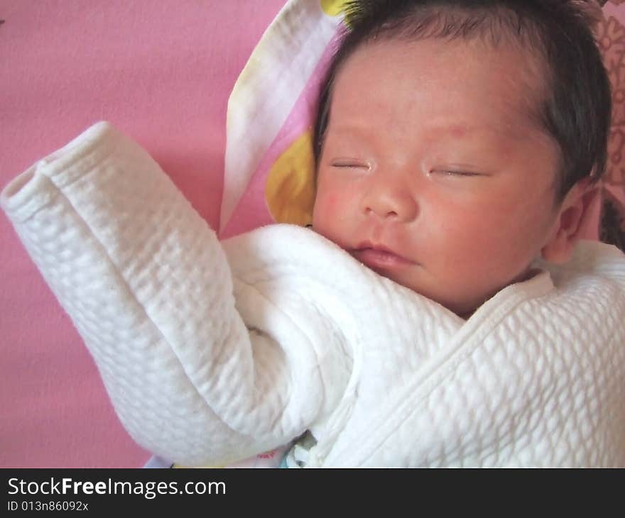 Sleeping Baby on a bed