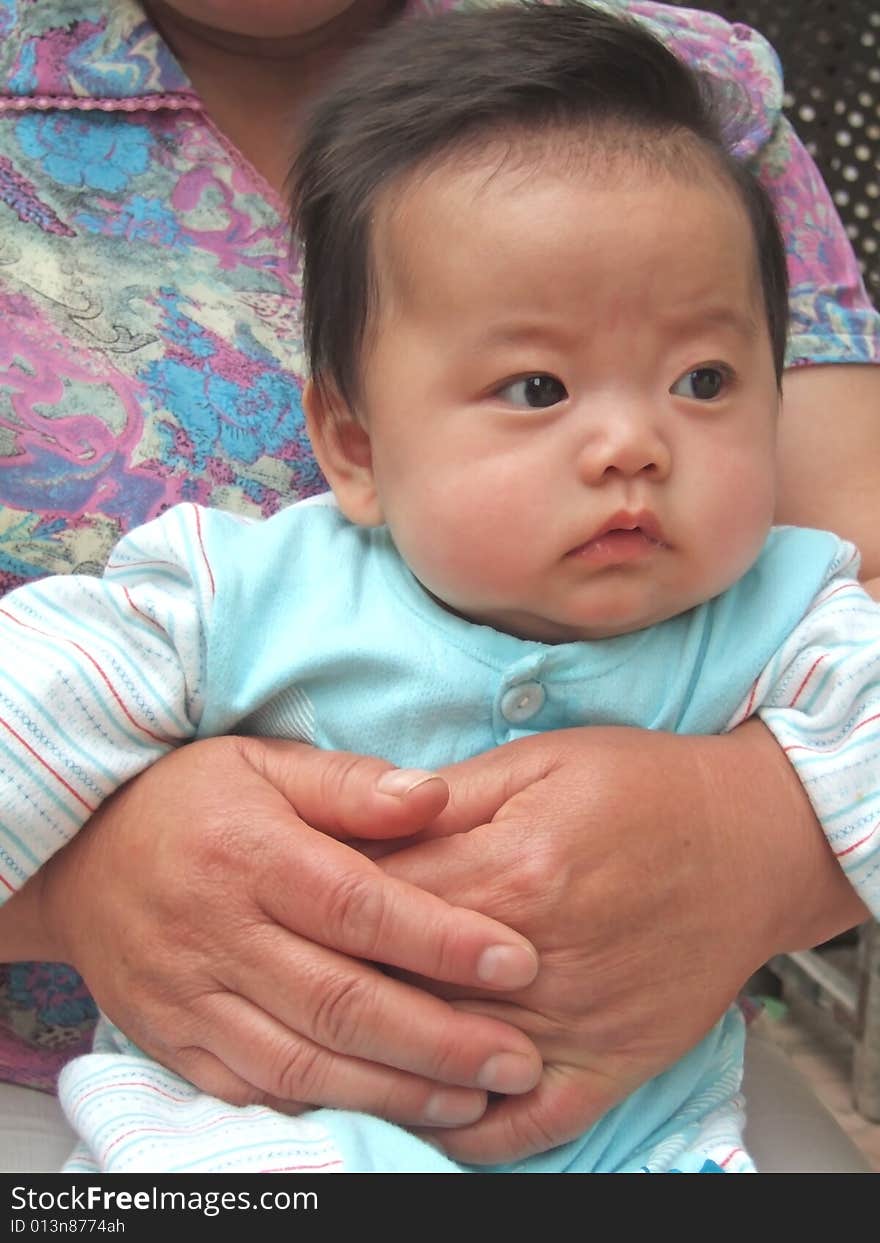 Pretty Baby on her grandmother's leg