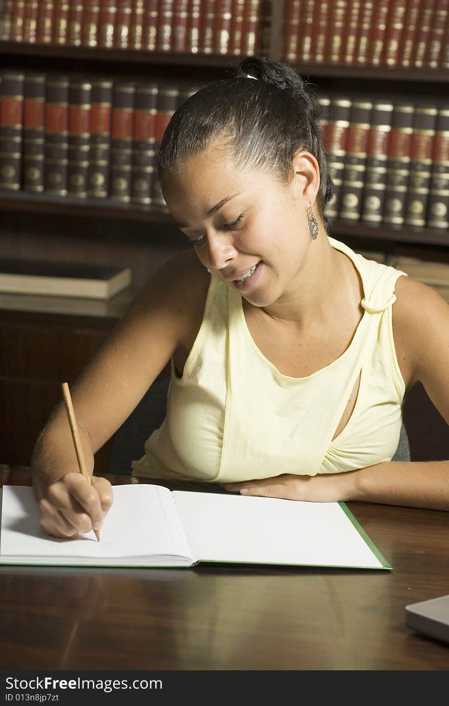 Woman Writing at Desk. Vertical