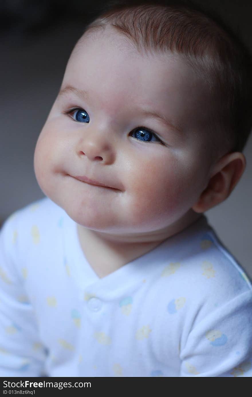 Baby looking up with beautiful blue eyes. Baby looking up with beautiful blue eyes