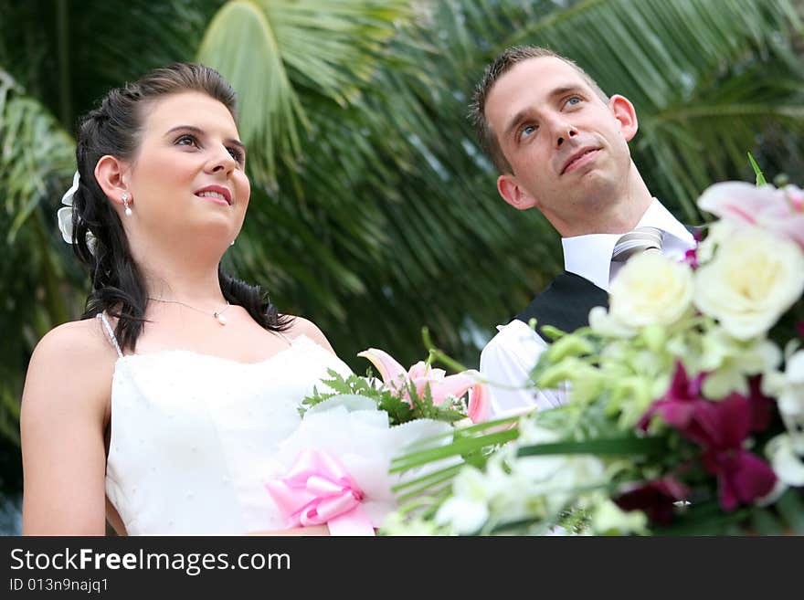 Bride and groom take vows during a wedding ceremony.