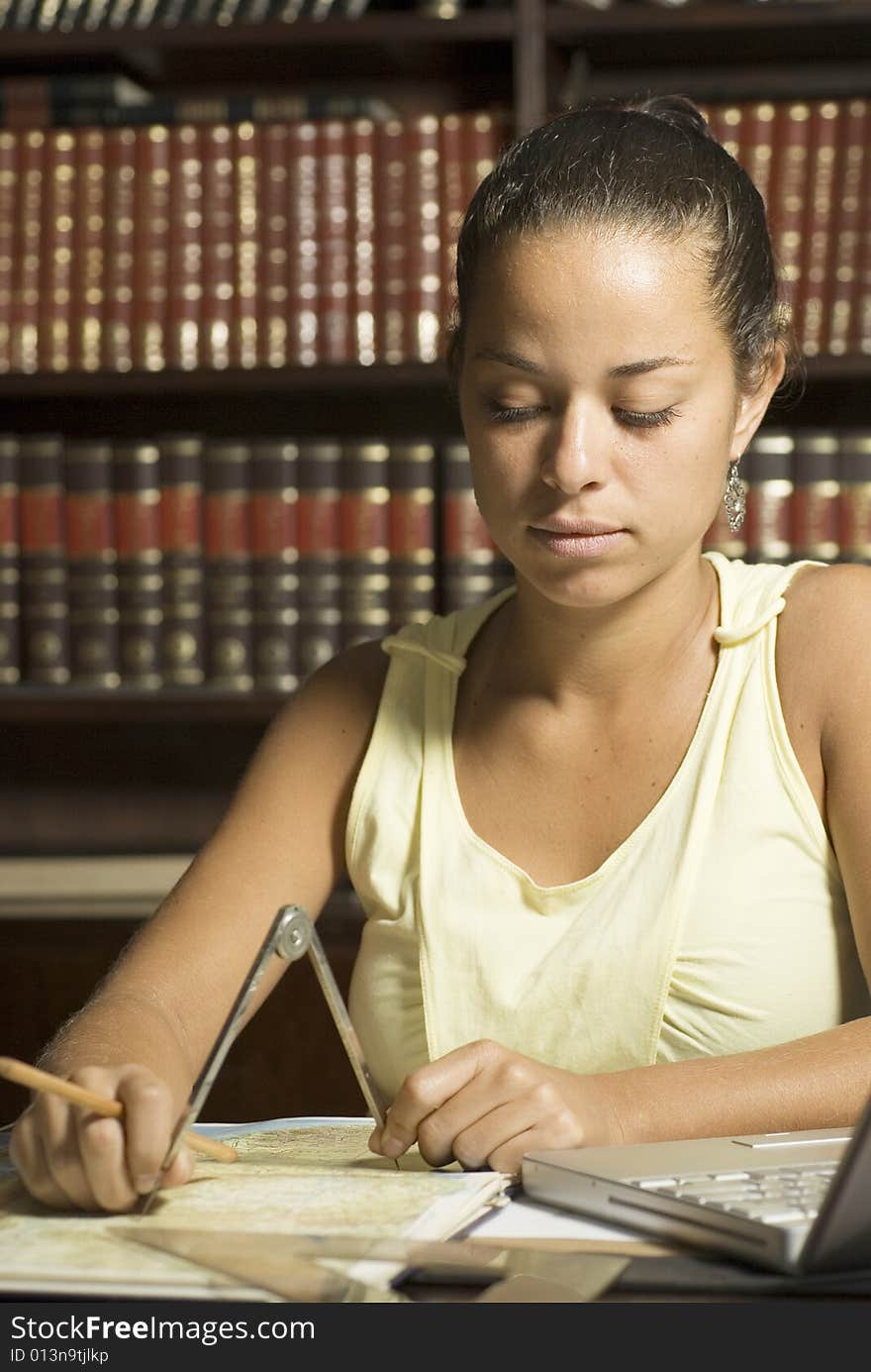 Woman Seated At Desk - Vertical