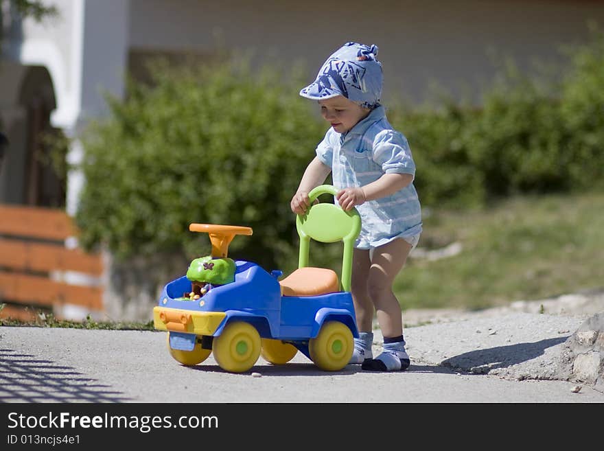 Happy and small boy with car in summer. Happy and small boy with car in summer