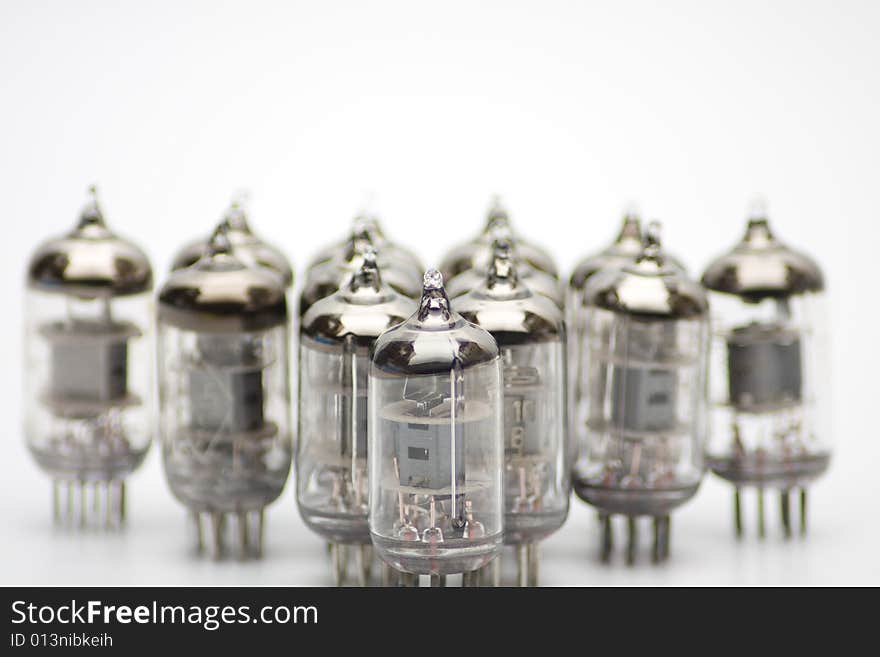 Row of old lamps on white background