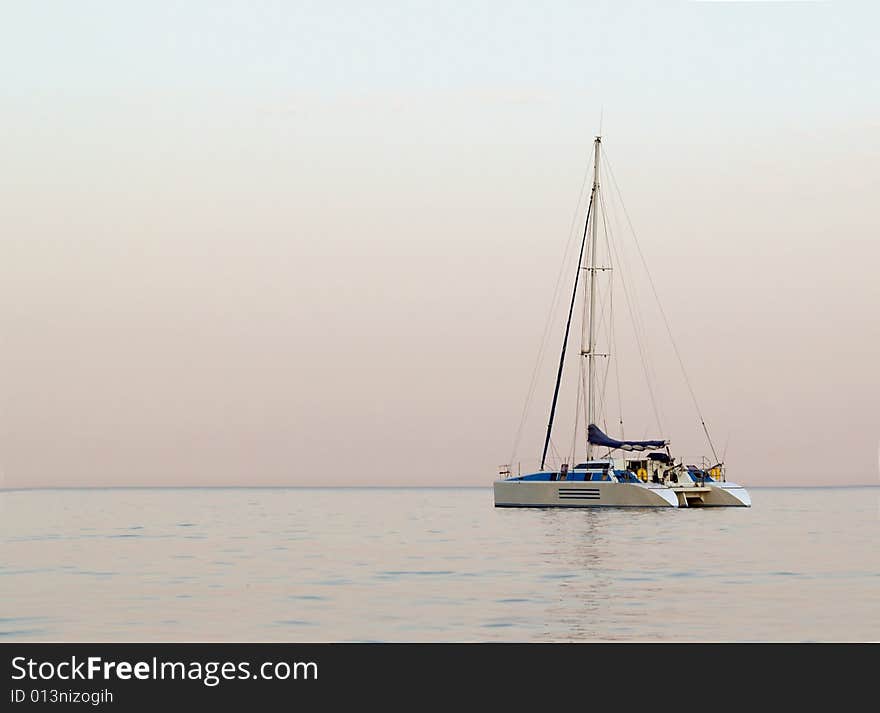 Sailboat in sailing on wide open sea