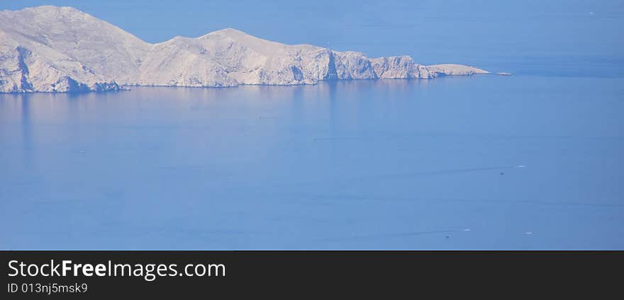 Croatia - panorama from the Velebit Mountain (Vratnik Pass) to the Adriatic Sea and Kvarner Bay - islands of Krk and Cres in the background **Horizontal panoramic image stitched of 2 images. Croatia - panorama from the Velebit Mountain (Vratnik Pass) to the Adriatic Sea and Kvarner Bay - islands of Krk and Cres in the background **Horizontal panoramic image stitched of 2 images