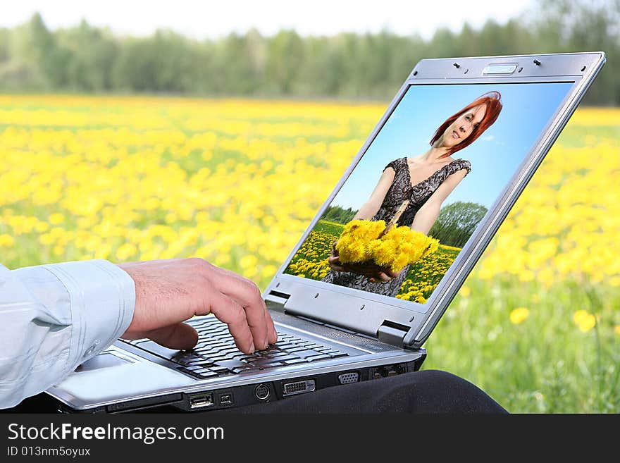 Laptop with picture of beautiful girl on desctop