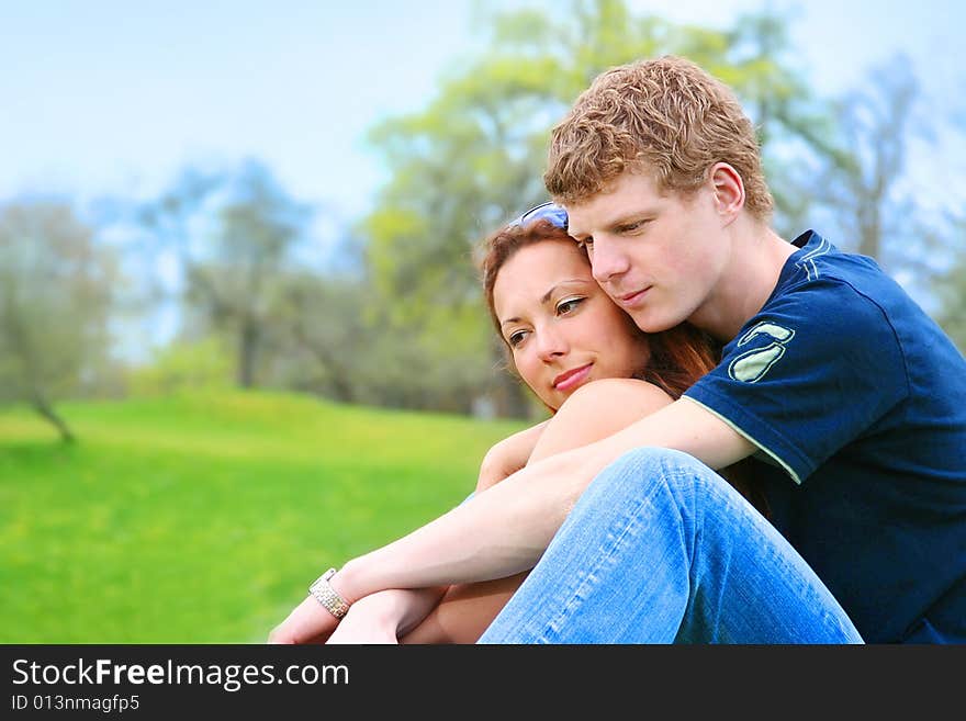 Happy young couple relaxing outdoors. Happy young couple relaxing outdoors