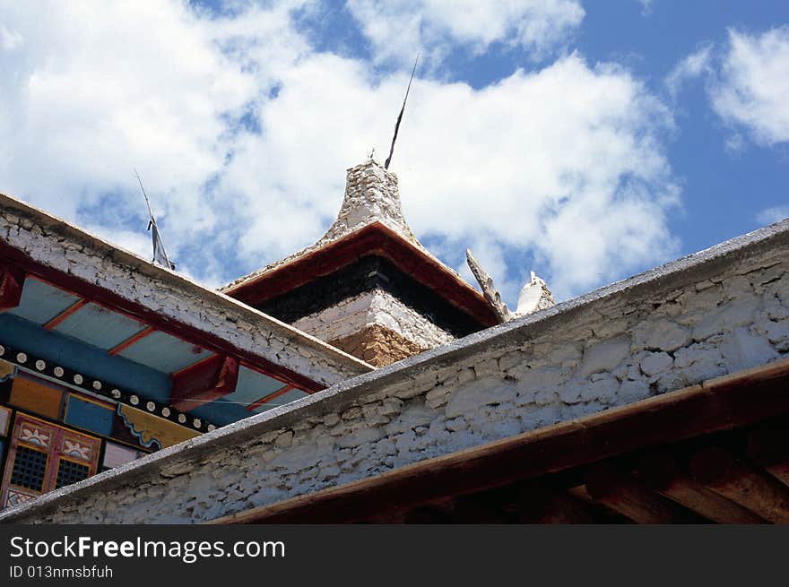 It is a Tibet House.  The photo was taken in Sichuan of China when I visited the Tobetan family.  The rooftop was painted.