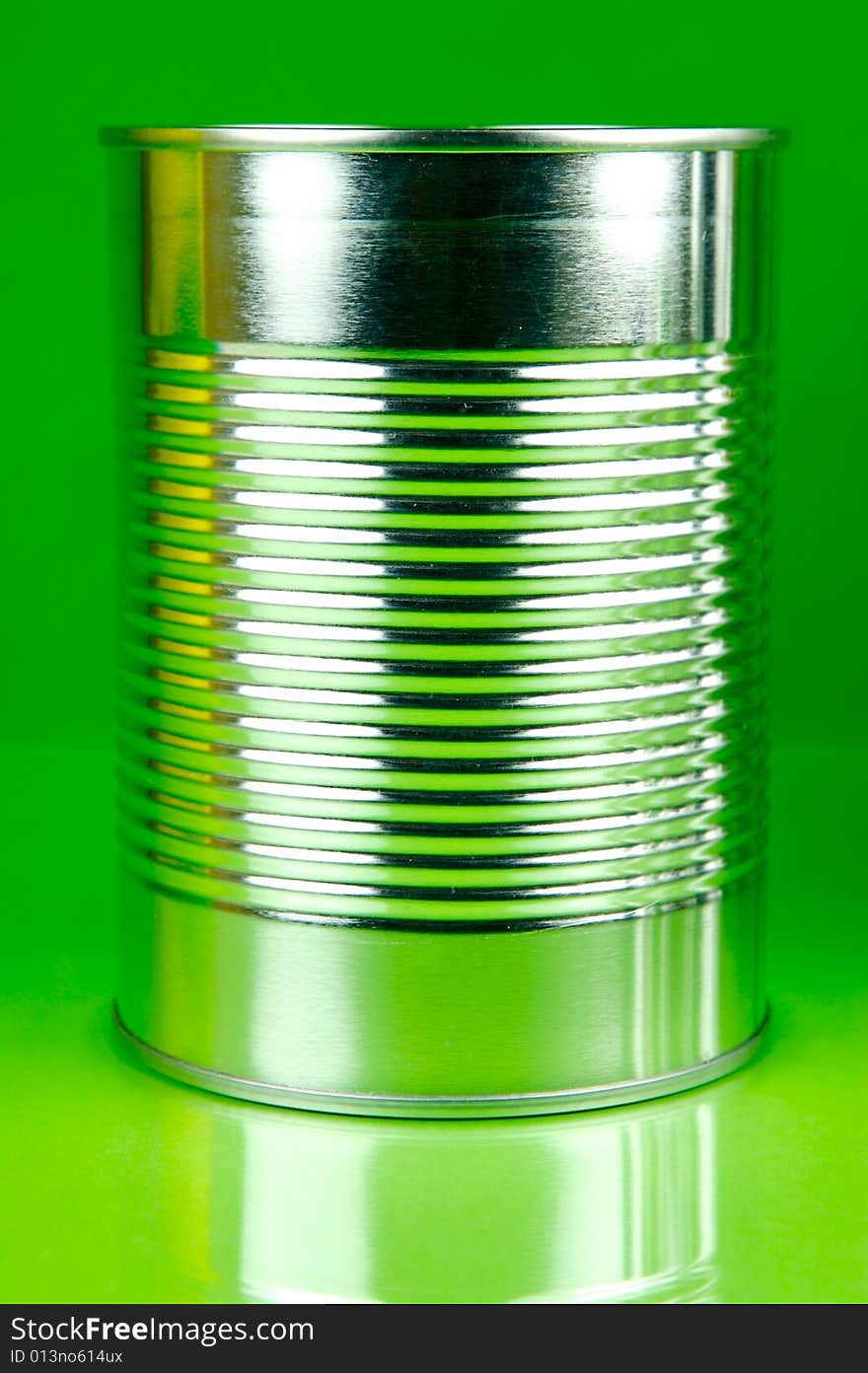 Assorted tins isolated against a green background. Assorted tins isolated against a green background