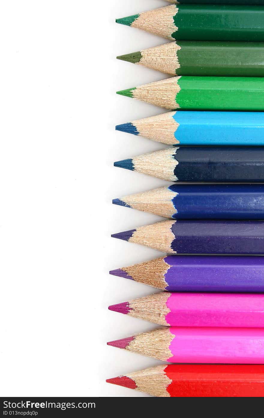 Line of crayons on white background