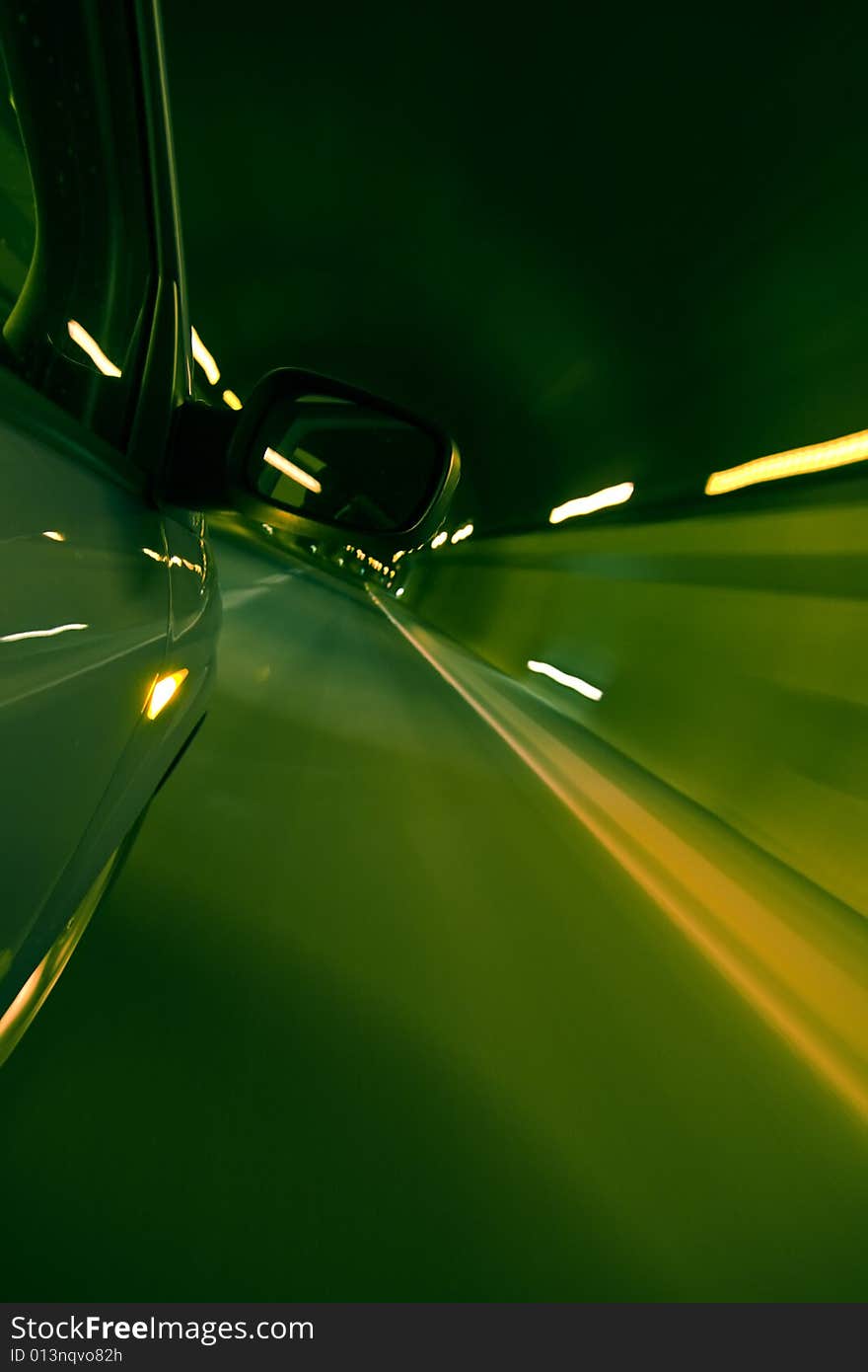 Driving fast inside tunnel, green toned. Driving fast inside tunnel, green toned.