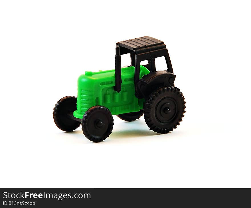 A small green toy tractor