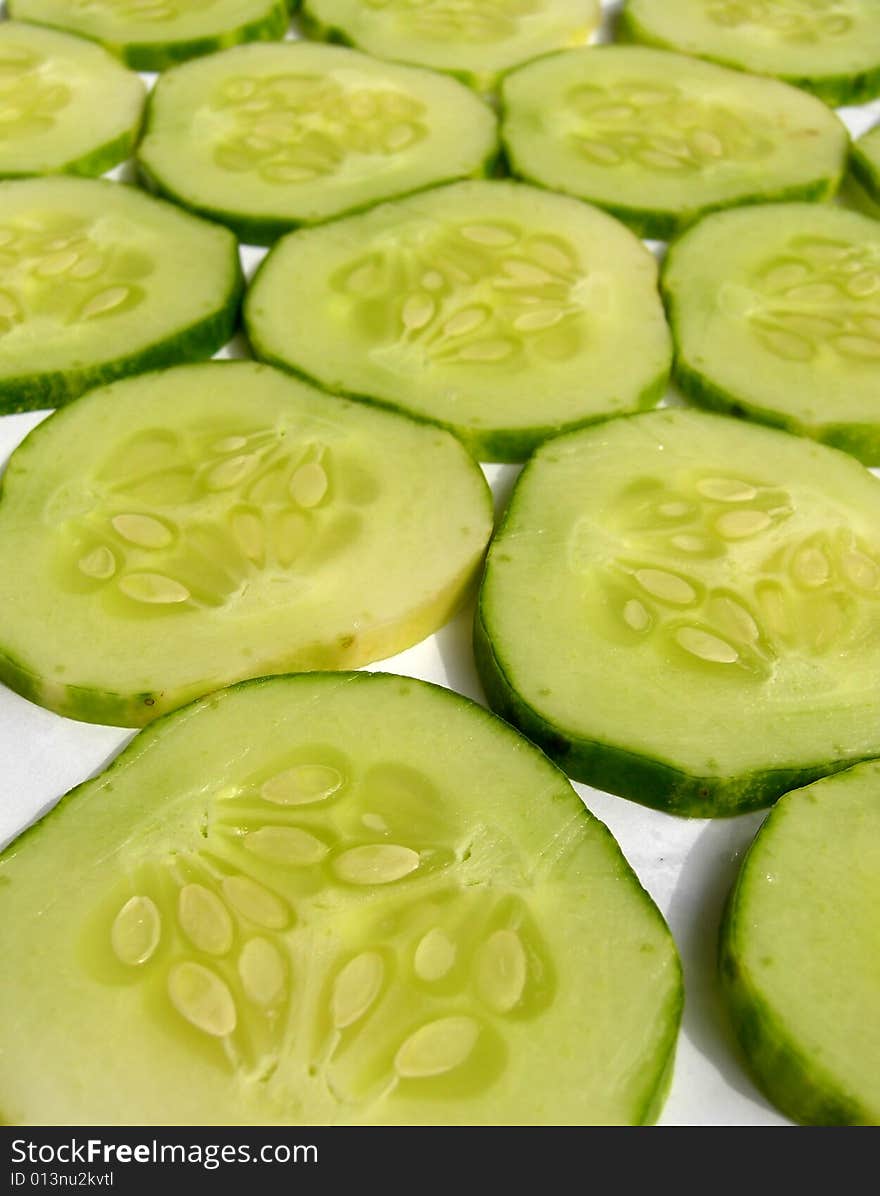 Cut cucumber big slices background