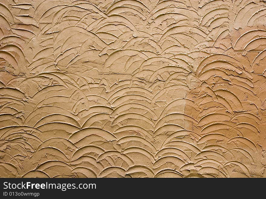 A design in brown stucco for backgrounds or texture. A design in brown stucco for backgrounds or texture