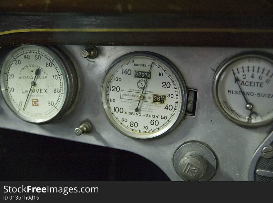 Some litle dials and knobs on an old sheet steel dashboard. Some litle dials and knobs on an old sheet steel dashboard
