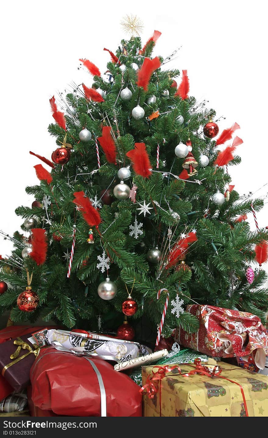 Presents of all sizes under a beautiful christmas tree. Presents of all sizes under a beautiful christmas tree