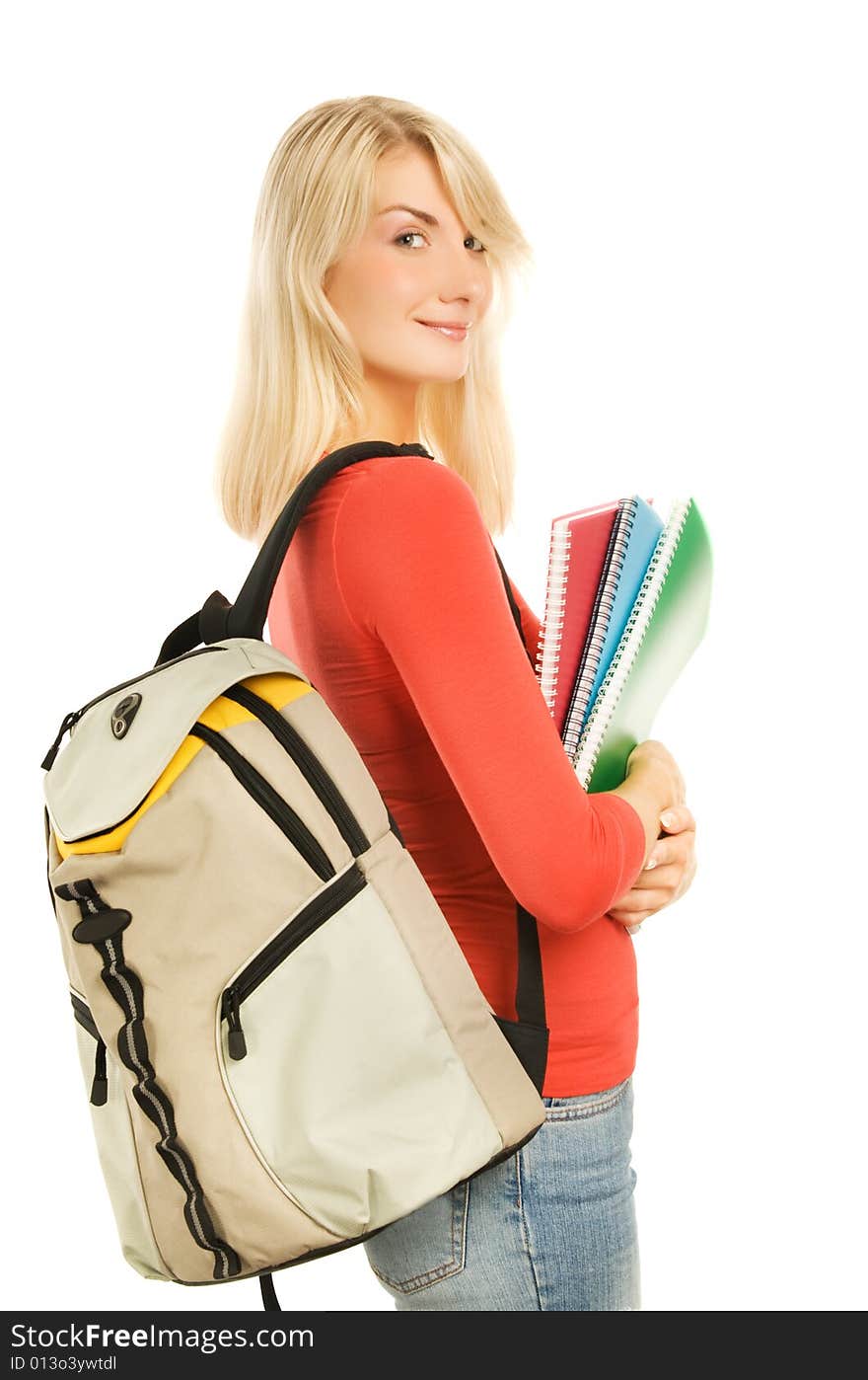 Attractive teenage girl with notebooks isolated on white background