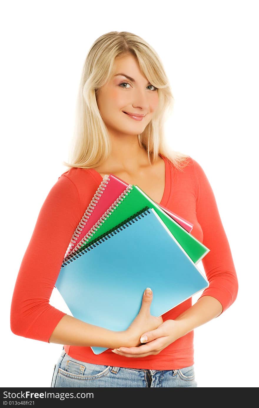 Attractive teenage girl with notebooks isolated on white background