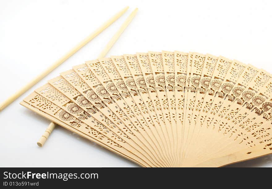 Culture of China, sticks and fan on a white background. Culture of China, sticks and fan on a white background