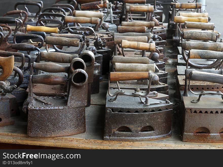 A row of old irons. A row of old irons