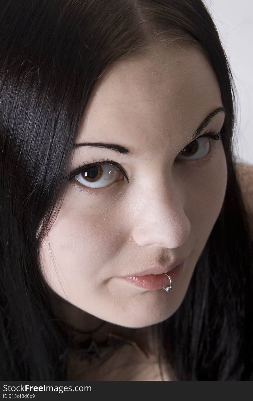 Portrait of a young woman with long black hair. Portrait of a young woman with long black hair