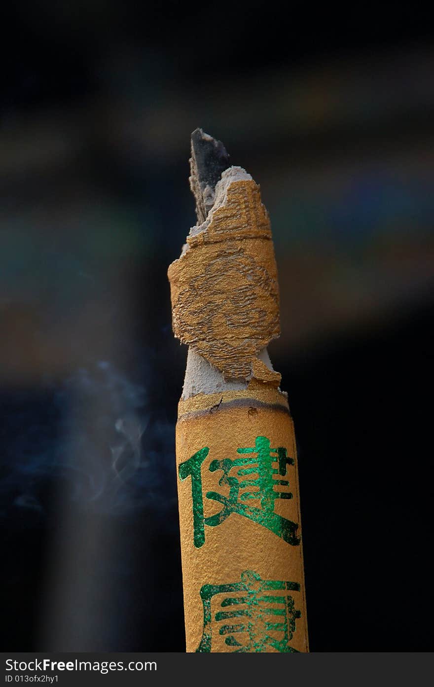 Buddhist aroma stick with smoke on black background