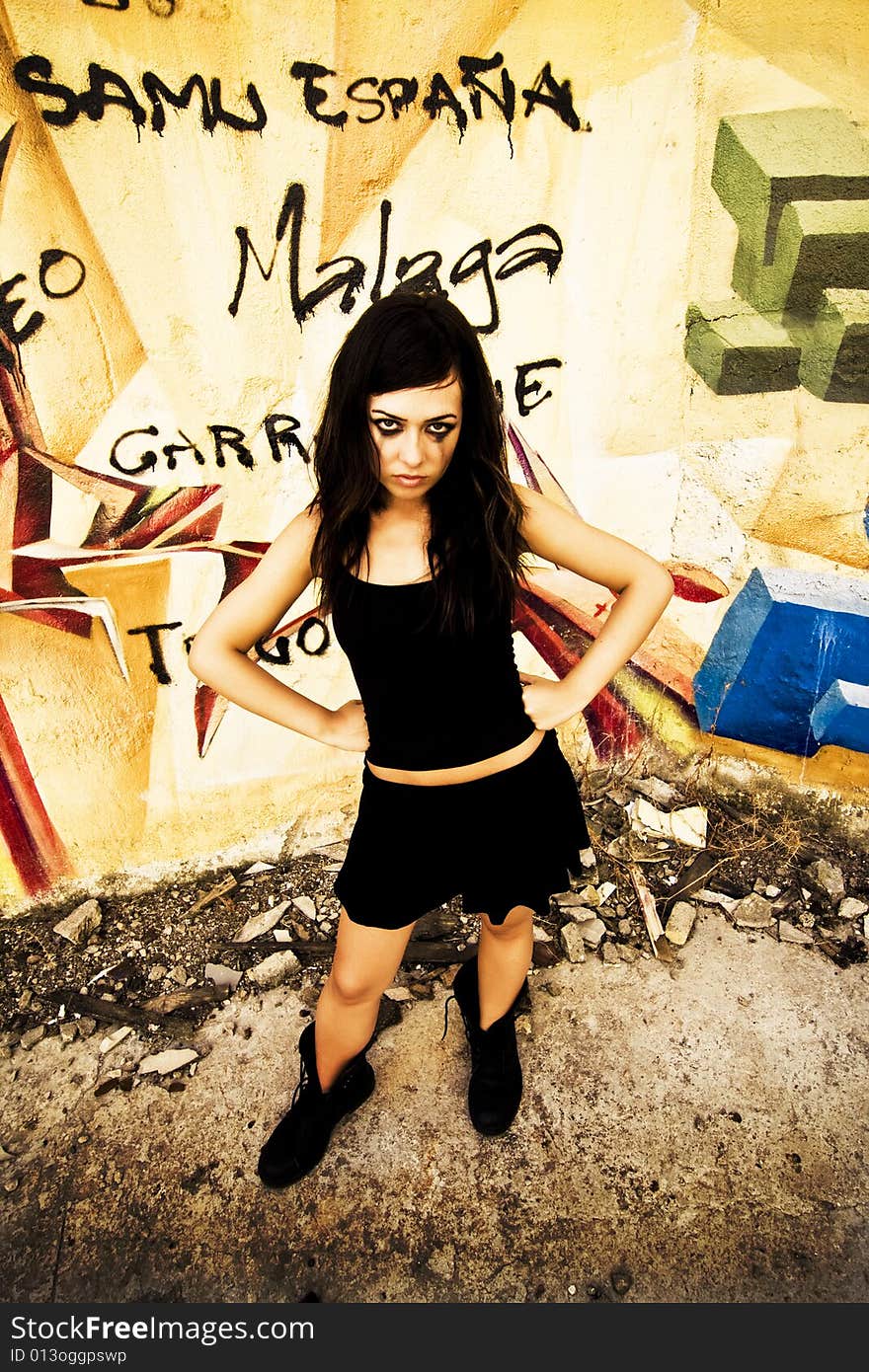 Goth girl posing in urban background.