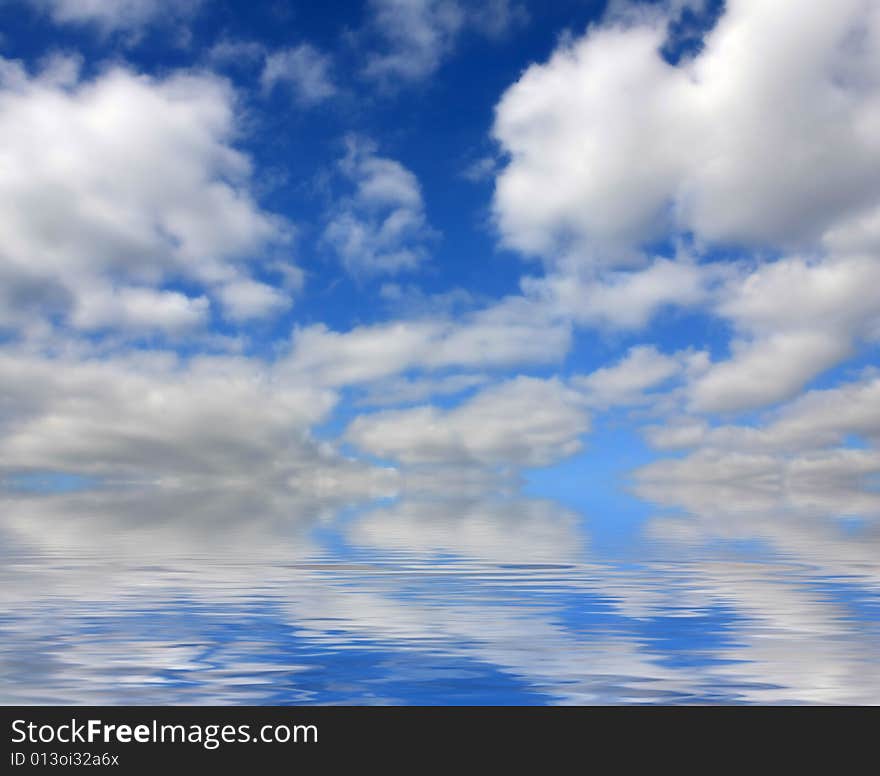 Seascape with blue sky and white clouds