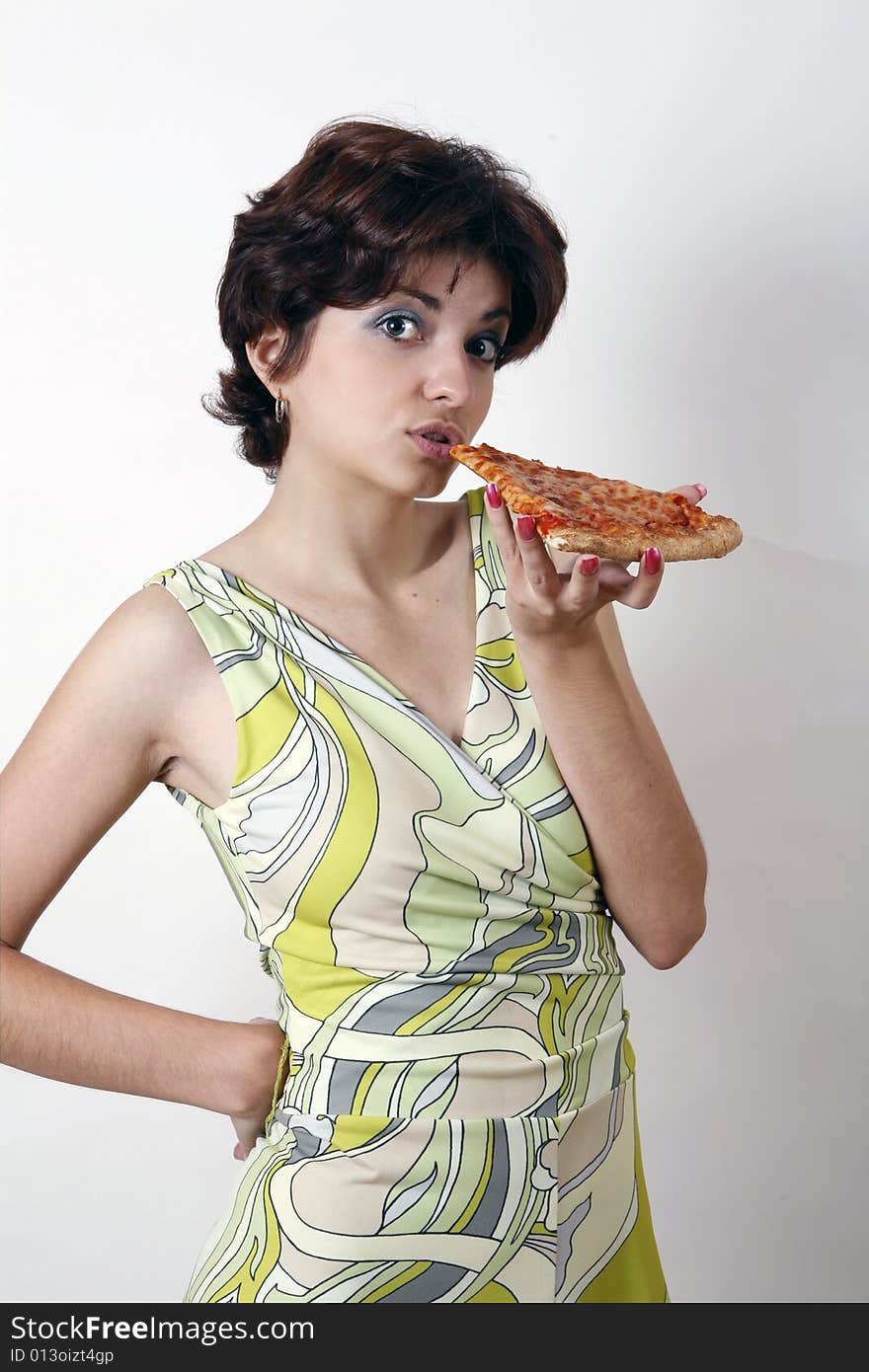 Sweet girl eating pizza slice